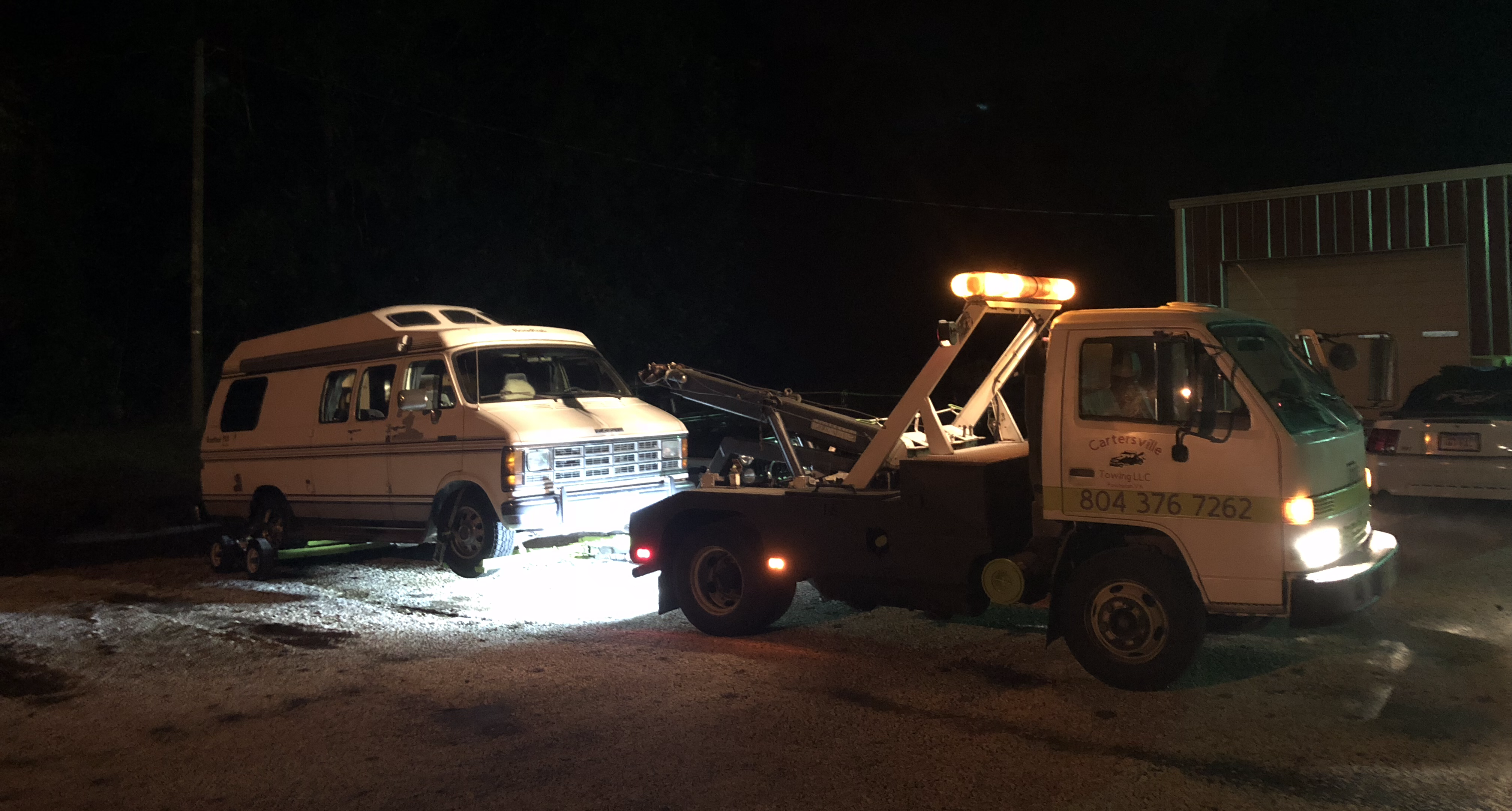 a Roadtrek being dropped off at a mechanics parking lot